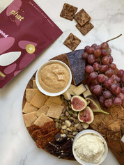 Real Phat Foods Almond Flour Crackers in Sweet Cinnamon Crunch served on a charcutier board